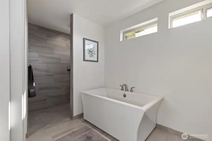 Soaking tub and curbless shower.