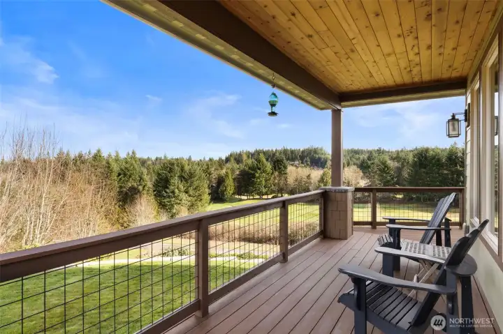 Relax and watch the hummingbirds on this covered side deck.