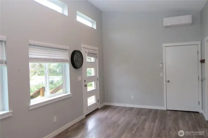 LIVING ROOM HAS DIRECT ACCESS TO THE ONE CAR GARAGE!  NOTE THE HEAT PUMP ABOVE THE DOOR!