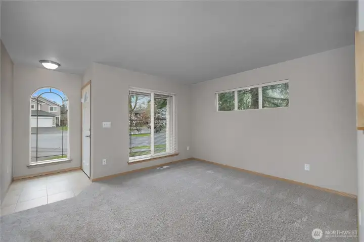 Living room, looking back to front door.