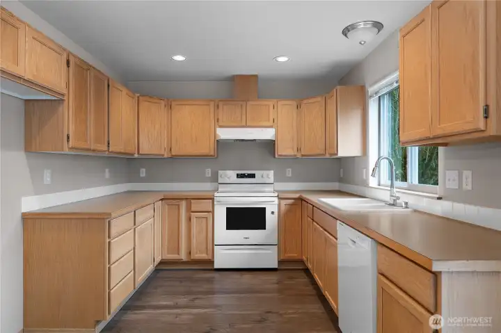 Great flow in the kitchen, features brand new range/hood and newer dishwasher