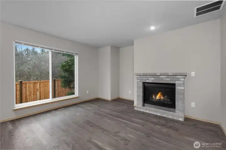 Family room features a gas fireplace, to stay cozy on those cold nights.