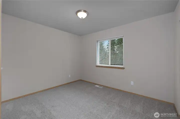 Second bedroom, home features brand new carpet!