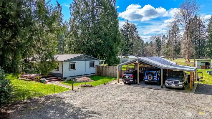 3 car carport with EV charger.