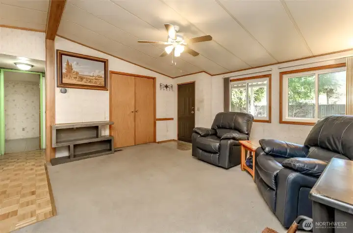 Living room with vaulted ceilings.