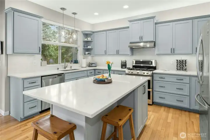 Renovated Kitchen with easy care quartz countertops and backsplash