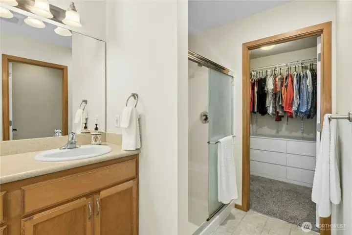 Walk in shower in primary bath leads to large walk in shower. Private water closet to the right.