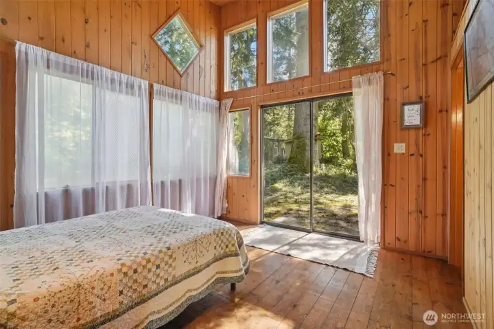 Primary bedroom with slider out to the yard