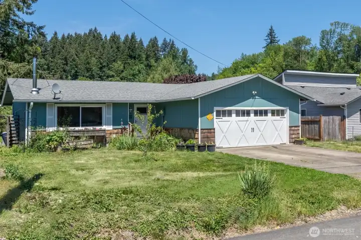 Large front yard with tons of flowers