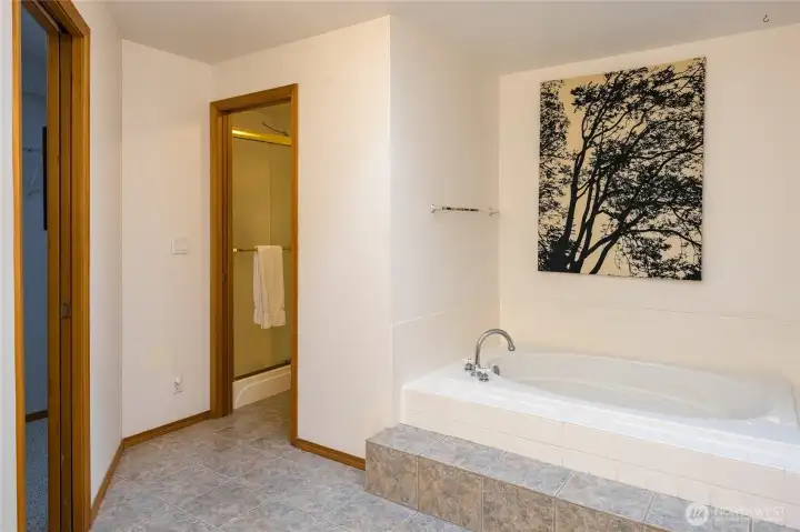 Separate soaking tub.