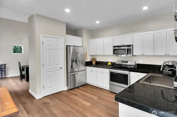 Kitchen w/ SS Appliances and Granite Tile Kitchen w/ SS Appliances and Granite Tile