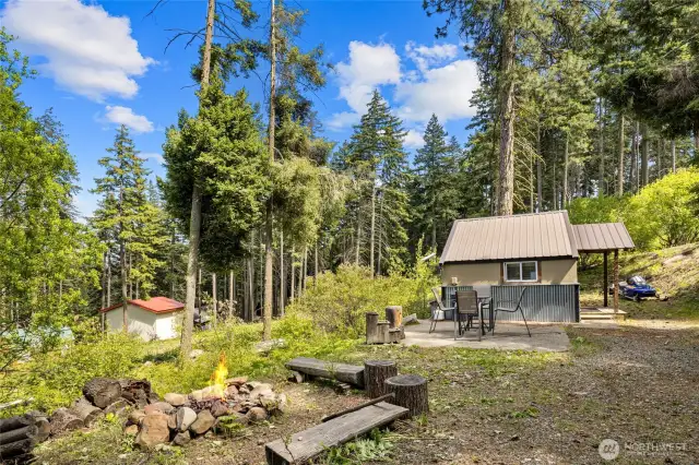 View from Bath house to the main cabin and concrete patio