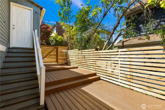 New fully fenced backyard with Trex decking.