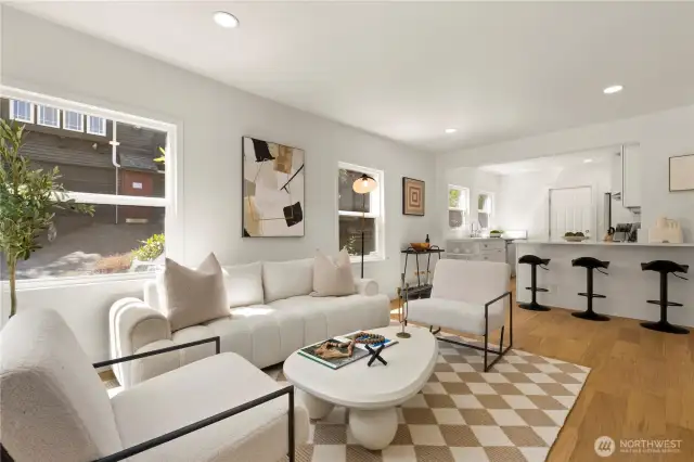Engineered hardwoods throughout living room, kitchen, and hallway