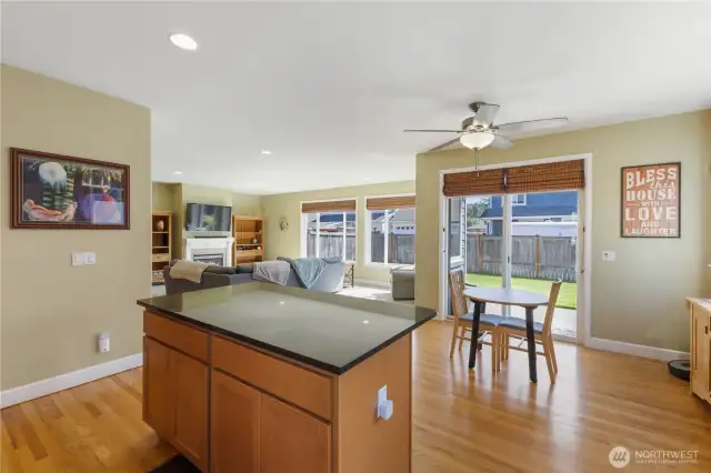 Spacious and light-filled, the separate eating area features a ceiling fan for comfort and seamlessly opens to the great room. A sliding glass door leads to the patio and backyard, where you’ll find a relaxing hot tub—perfect for unwinding at the end of the day.