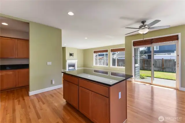 Spacious and light-filled, the separate eating area features a ceiling fan for comfort and seamlessly opens to the great room. A sliding glass door leads to the patio and backyard, where you’ll find a relaxing hot tub—perfect for unwinding at the end of the day.