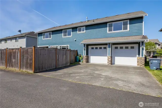 View of the back of the home and garage.