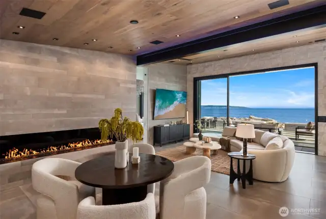 Experience seamless indoor-outdoor living as the sliding door opens to panoramic views of the deep water shipping lanes.