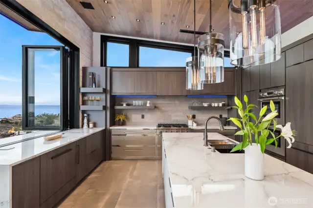 The kitchen windows slide open to a built in marble bar.