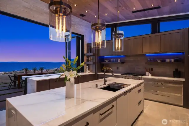 Restoration Hardware lighting highlights the stunning marble countertops.