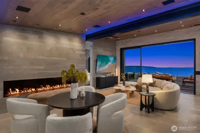 This 100 inch linier gas fireplace is gorgeous and is the perfect place to cozy up to as the storm moves in. The warm radiant floor offers heat, and cooling. AMAZING!