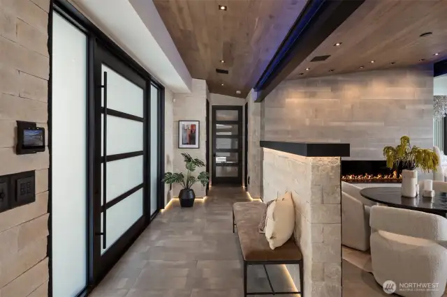 This home is loaded with custom-fabricated steel, from the beams to the light switch plates. Live-edge stone is highlighted by LED floor and ceiling lighting with mood-changing effects.