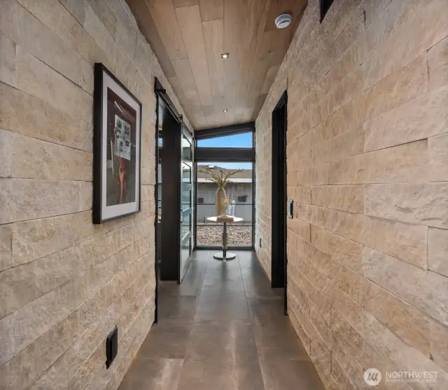Under wall lighting showcases the gorgeous split edges stone walls. Every door frame has been framed in steel. A true show stopper!