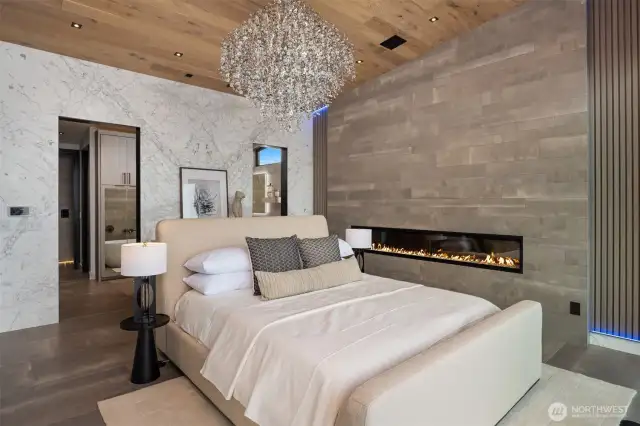 Welcome to where you can say your dreams have come true. Look at the wall of book matched marble behind the bed. Wowza!