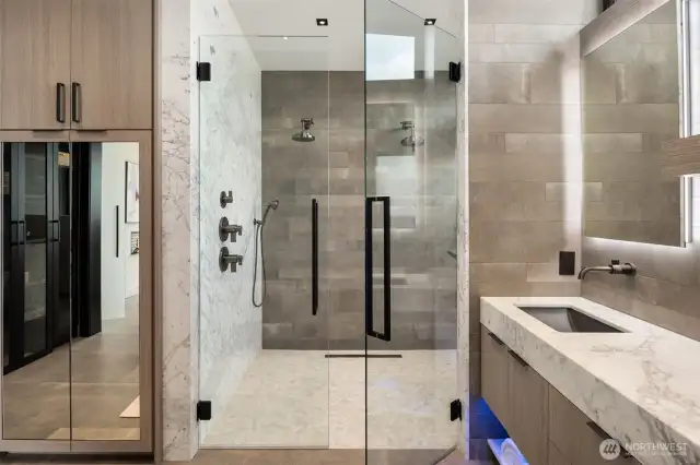 Step inside to your steam shower with dual shower heads, curb less shower, and marble slab wall. I loved being spoiled.