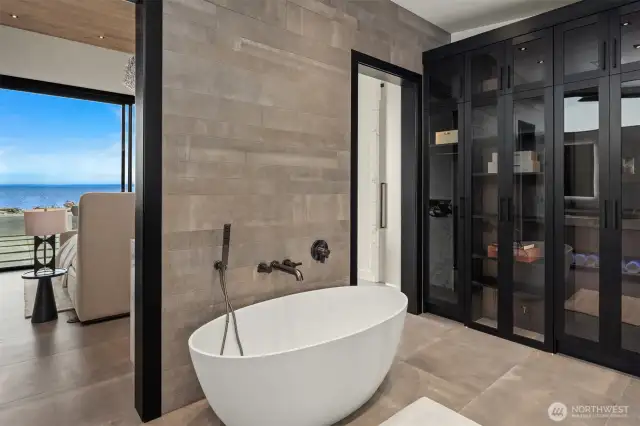 Okay a wall of glass lit cabinetry to display those collectable watches and designer handbags. YES!  AND you have heated radiant floors throughout the home.