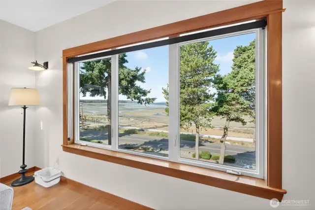 Big bay windows have tint on glass and dark roll down shades for increased sun coverage if desired.