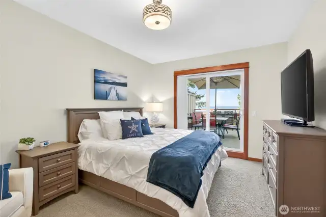 Large primary bedroom with with outside access and water views!