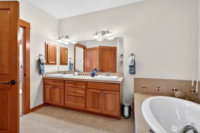 luxurious soaker tub and quality wood doors and cabinetry