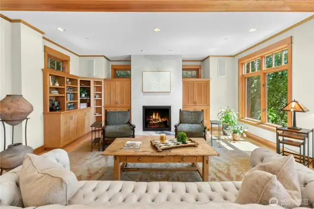The Living room, part of the Great room, features a Gas Fireplace and TV connection behind the painting.  Conduits lead from the TV connectors to the built in Sonos Speakers (which stay).