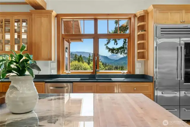 Mount Rainier View!! Commercial Grade Sub-zero Refrigerator with upgraded stainless steel lining offers bacteria resistance, is easy to clean and is reflective in nature for improved visibility. New Quartz Countertops with Butcherblock prep space and warming drawer underneath.