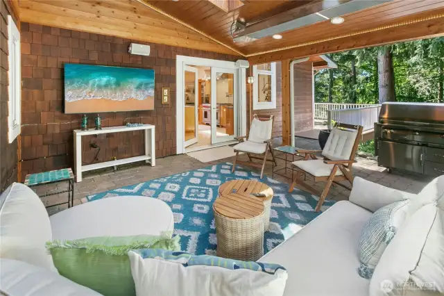 Continue entertaining outside in your covered outdoor living space.  This space offers built in TV mount, speakers, electrical heaters, gas grill hookup, additional electrical outlet for future outdoor refrigerator, both rope and recessed lighting (if the skylight is not enough!).