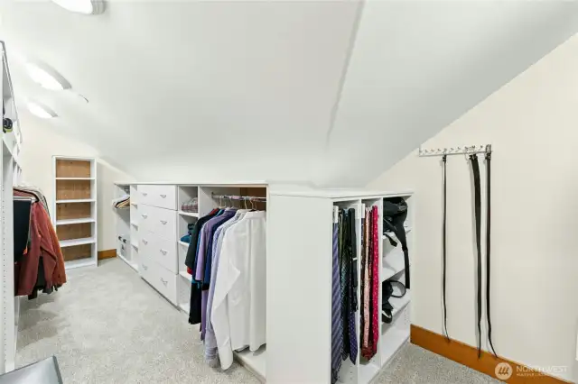 1 of 2 Walk-in closet, featuring built in, cedar backed organizers, pull out valet bar and tie racks.