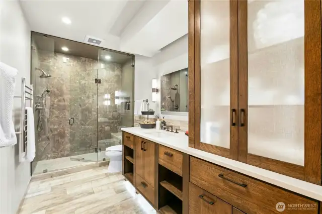 3/4 Bath w/ Marine Grade built-in Shower Speakers, Hidden Electrical Outlets in drawers, USB connection and volume control in drawer for music, Lit Cabinetry for spa-like luxury and mirror slides up to reveal the Hidden Medicine Cabinet!