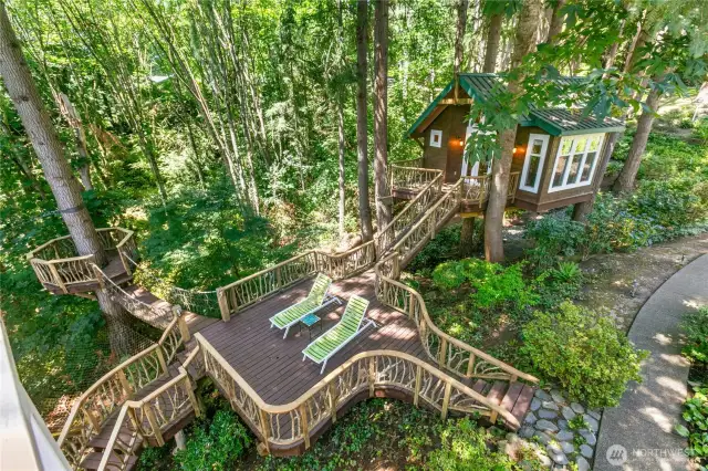 Treehouse retreat built by Treehouse Master Pete Nelson! Suspension bridge leads to the Zipline Aerial Launch Platform and the Large Patio was previously home to a hot tub and does still have electric connections.