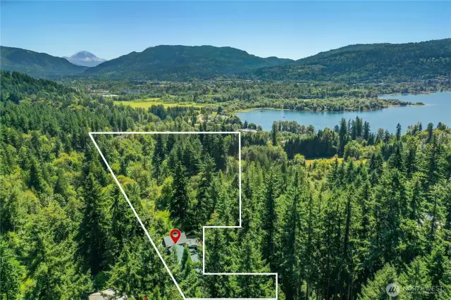 General visual of the size and scope of this 5.049 Acre / 219,939 sq ft lot. The flat space for additional parking or future garage space is in the bottom right most extension.