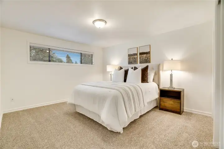 Primary suite with mid-century windows that flood the room with natural light while ensuring added privacy.