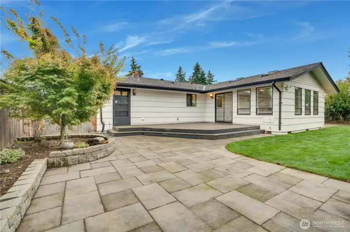 The outdoor space offers versatile flexibility for multiple living areas—perfect for entertaining, play, or peaceful retreats.