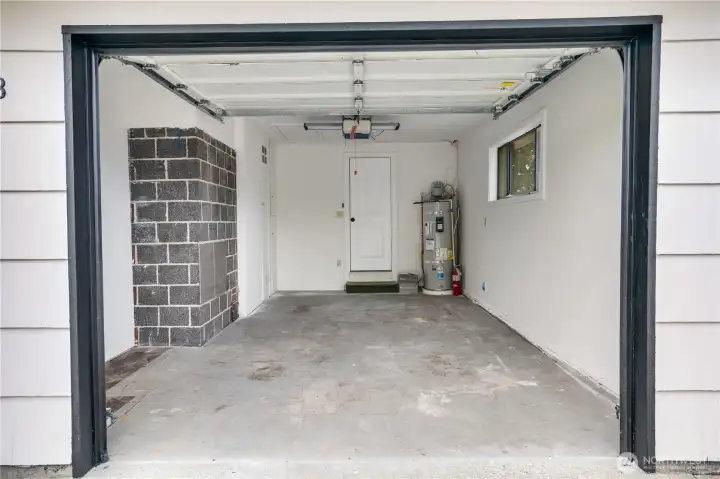 Finished one-car garage with new furnace and water heater for year-round comfort and efficiency.