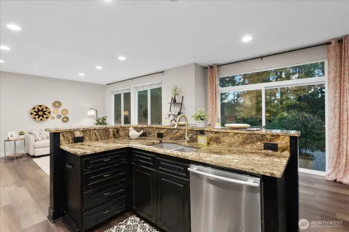 Open concept with family room and sliding door to backyard