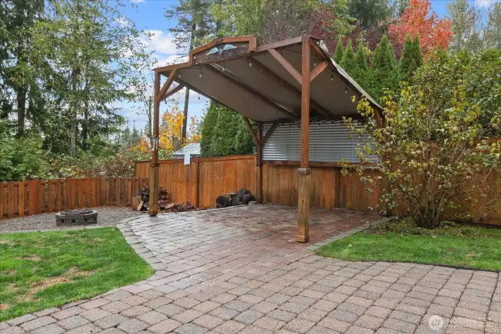 Covered patio space next to the firepit