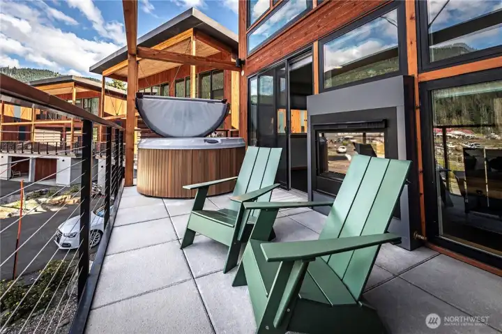 Deck views, grill, and hot tub. Photo from previous listing of the same model of home.