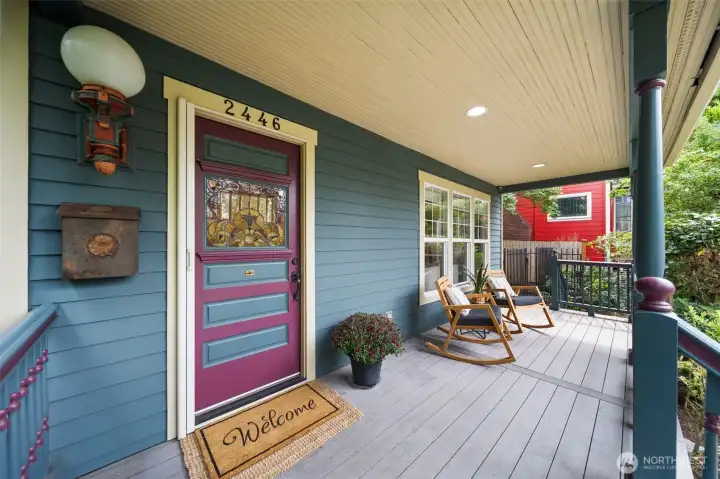 Inviting front porch overlooking tree lined Queen Anne Ave N