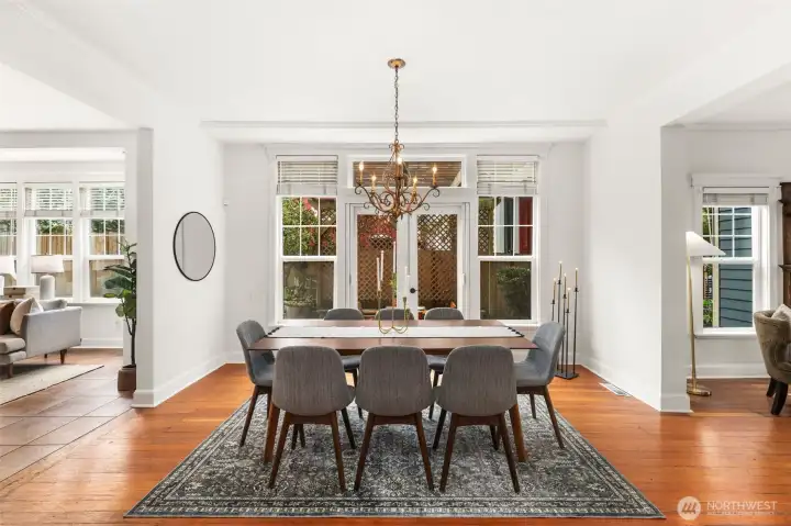 Grand dining room is perfect for large dinner parties, or step through the french doors to the brick patio for more casual, outdoor dining.