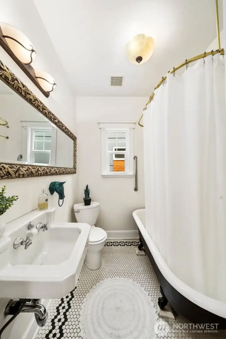 Hall bath boasts original design details.