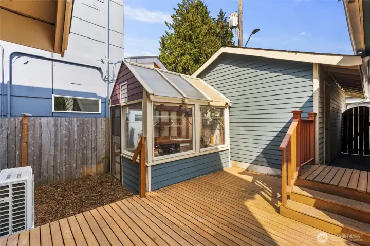 The green house just outside the back door allows for gardening in the city!